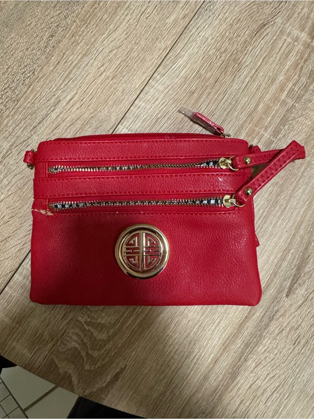 Red Women's Zip Pouch Wristlet with Gold Medallion Accent